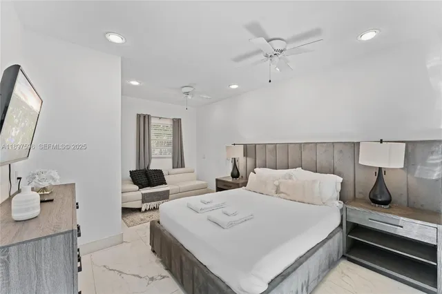 a bedroom with a bed and window