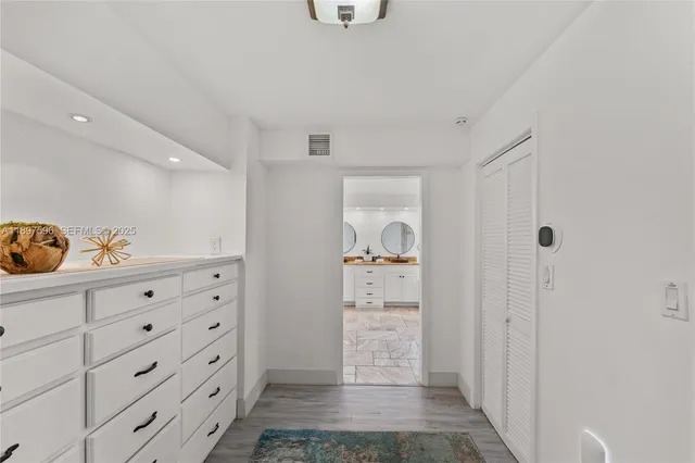 a view of storage and utility room with closet