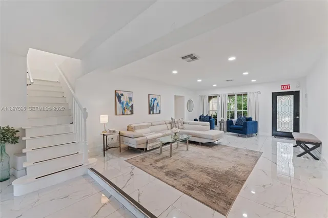 a living room with furniture and a couch