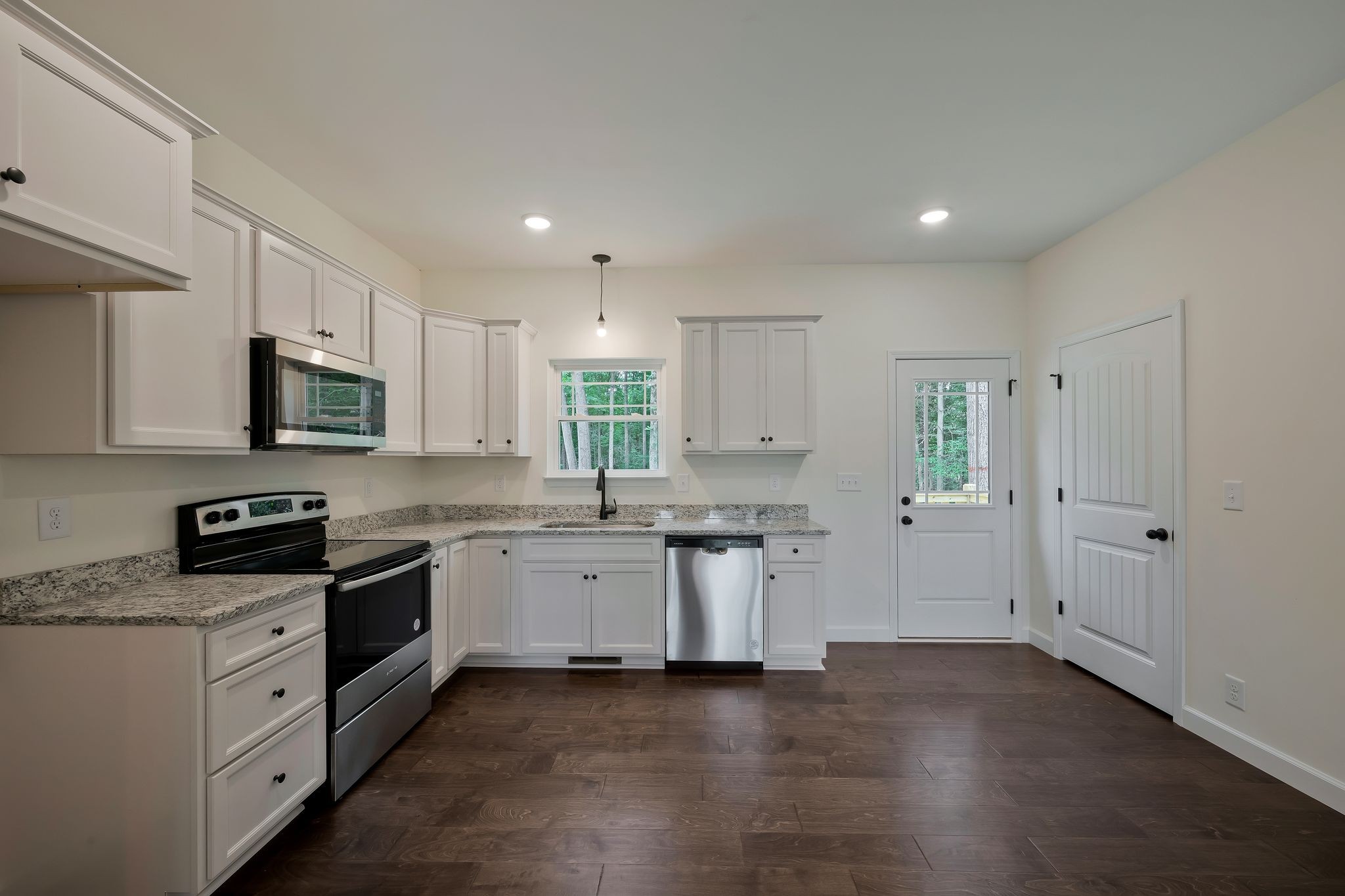 845 Lucas Road Dickson, TN 37055 - Photo 11 of 31 a kitchen with granite countertop white cabinets and white appliances