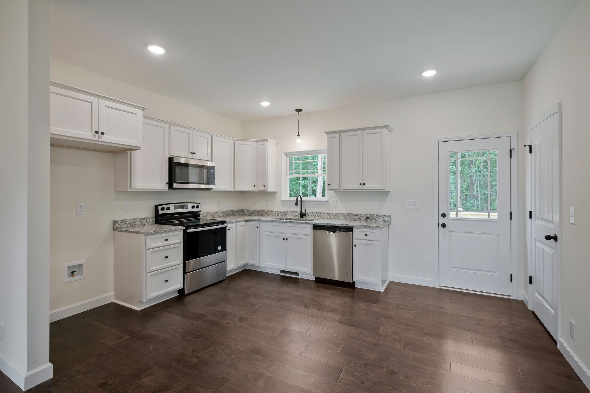 845 Lucas Road Dickson, TN 37055 - Photo 12 of 31 a kitchen with granite countertop white cabinets and white appliances