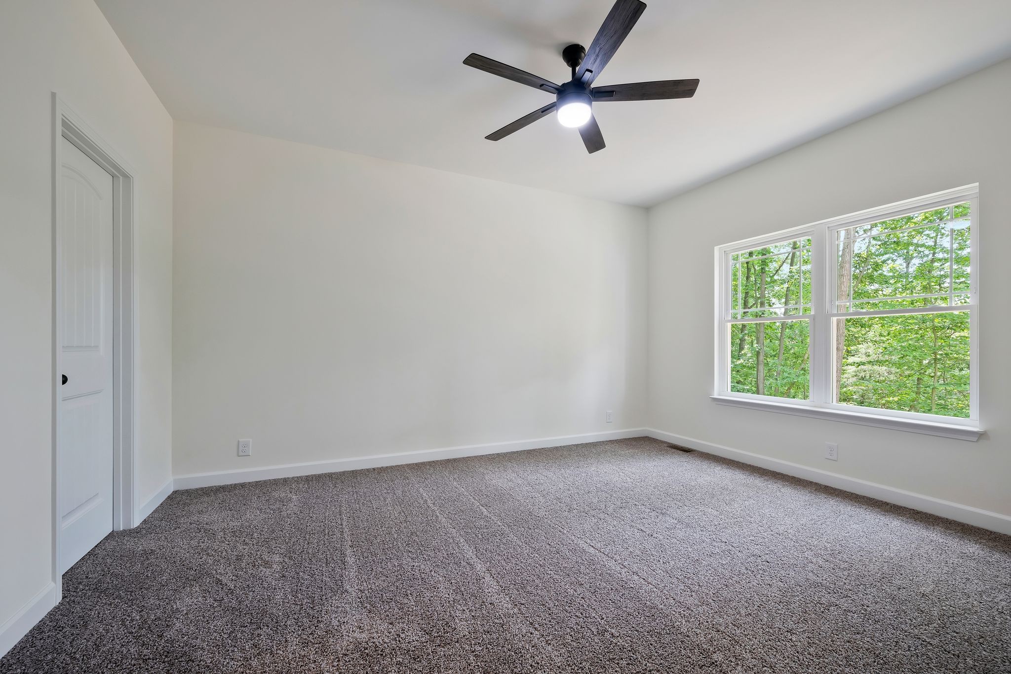 845 Lucas Road Dickson, TN 37055 - Photo 16 of 31 an empty room with a window and a fan