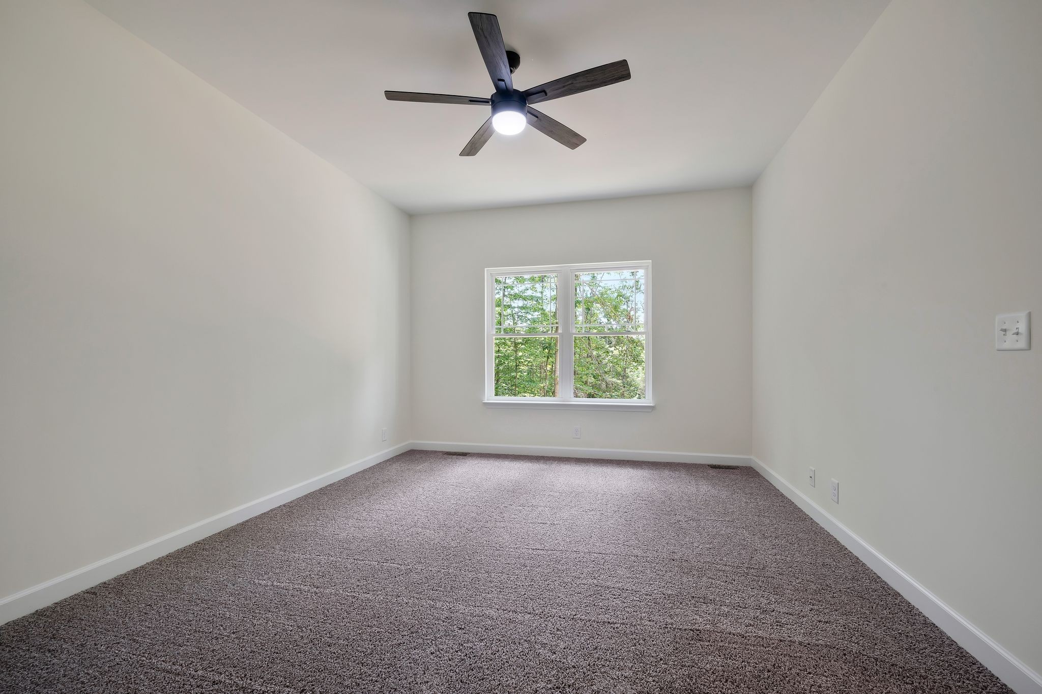 845 Lucas Road Dickson, TN 37055 - Photo 17 of 31 an empty room with a window and a fan