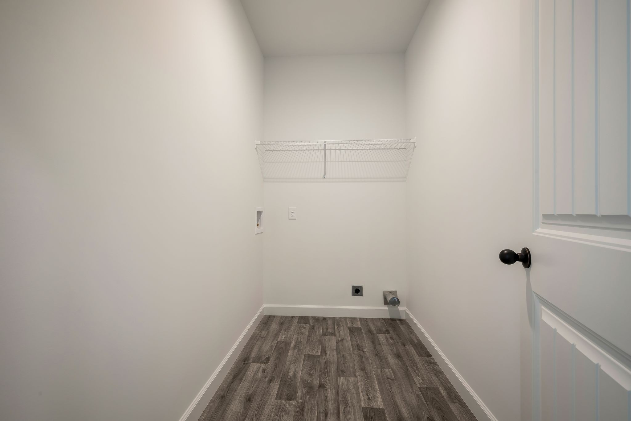 845 Lucas Road Dickson, TN 37055 - Photo 24 of 31 a view of a room with wooden floor and small racks