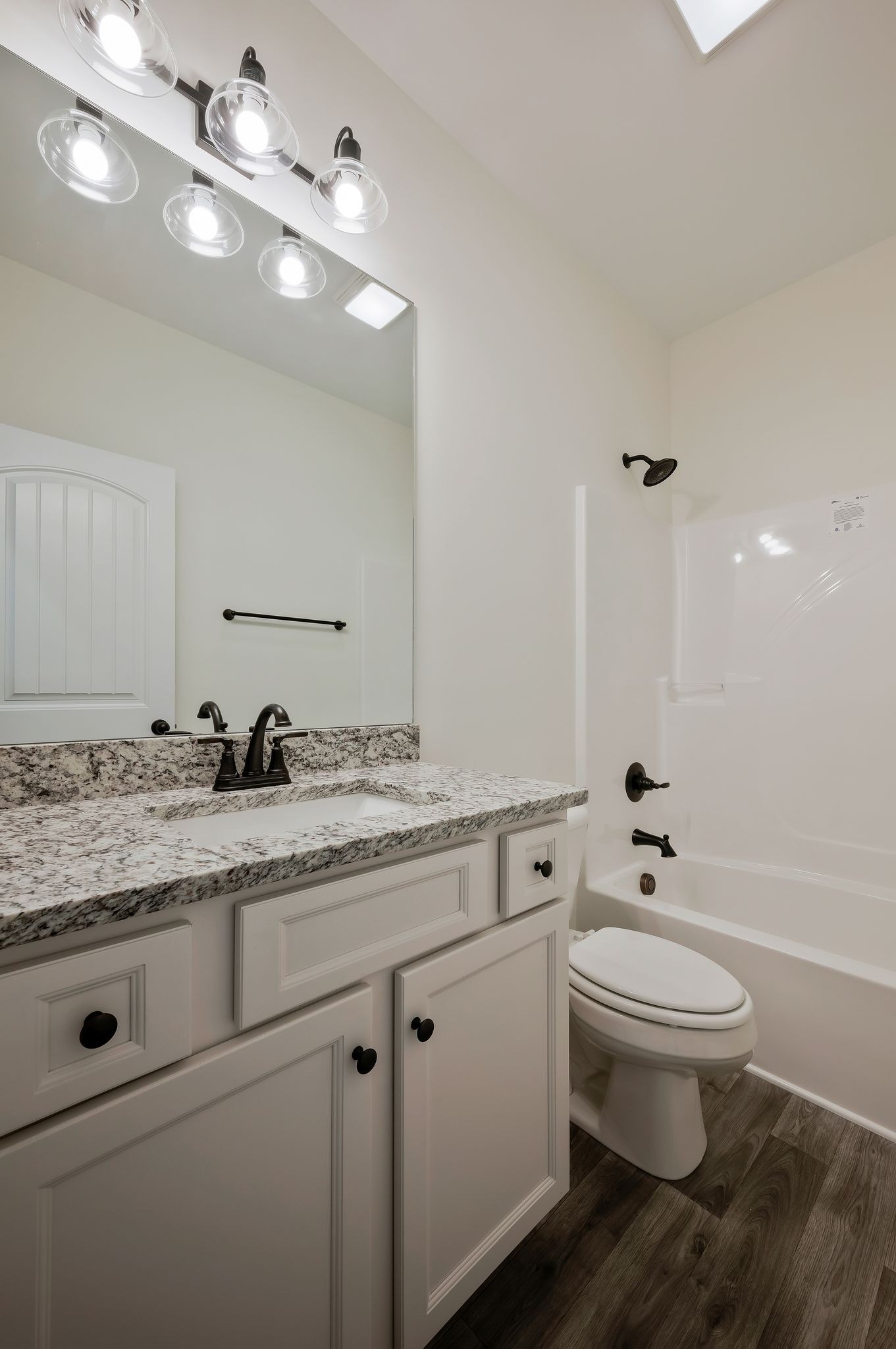 845 Lucas Road Dickson, TN 37055 - Photo 25 of 31 a bathroom with a granite countertop sink a toilet and a mirror