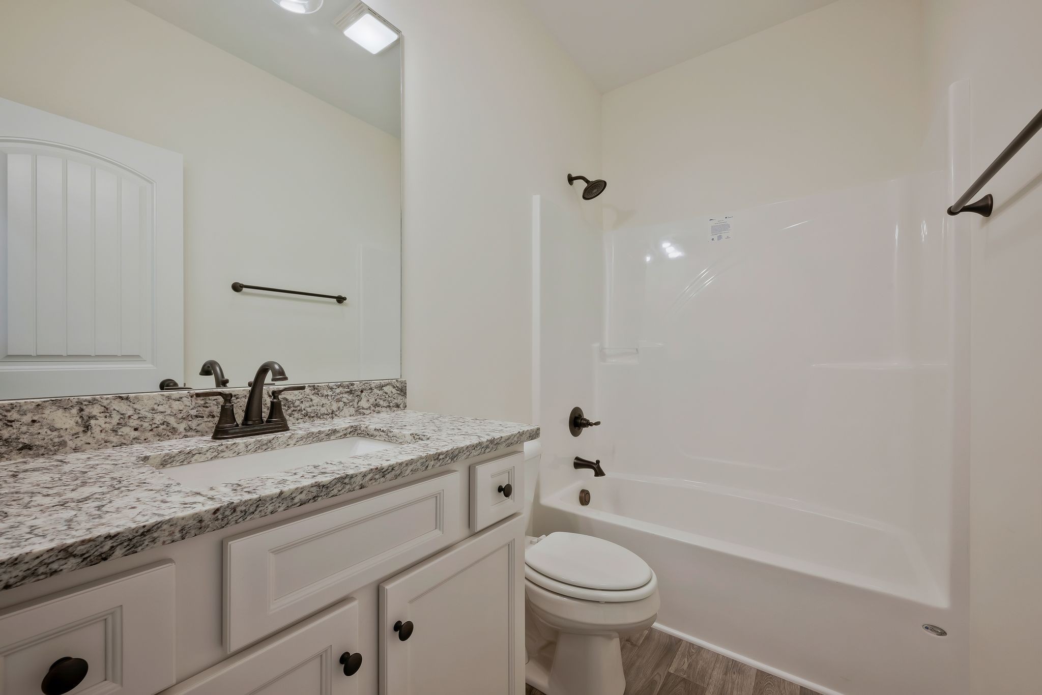 845 Lucas Road Dickson, TN 37055 - Photo 26 of 31 a bathroom with a granite countertop sink a toilet and bathtub
