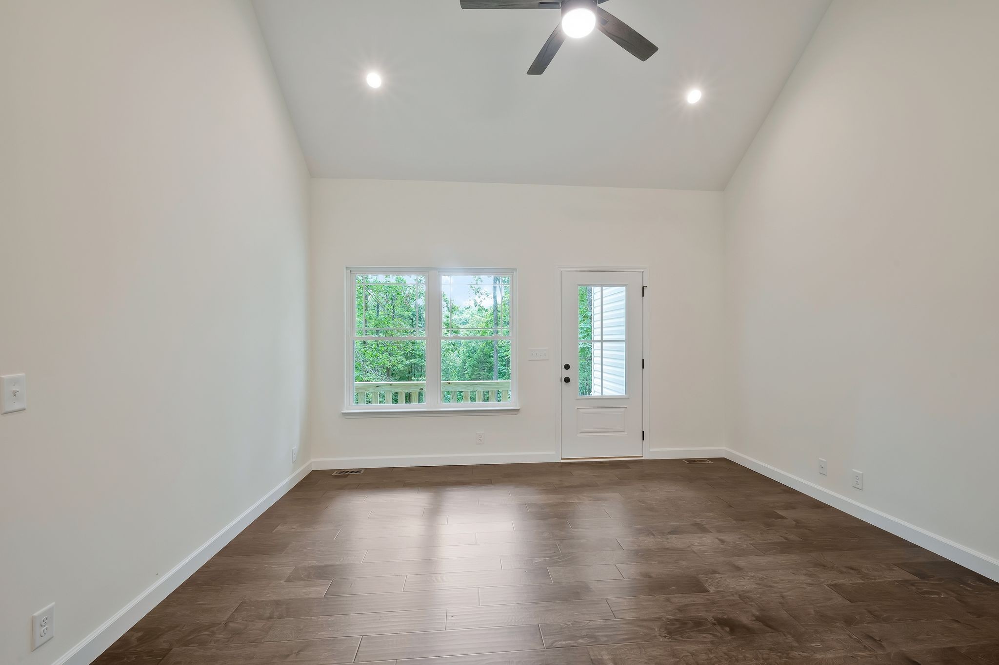 845 Lucas Road Dickson, TN 37055 - Photo 6 of 31 an empty room with wooden floor and windows