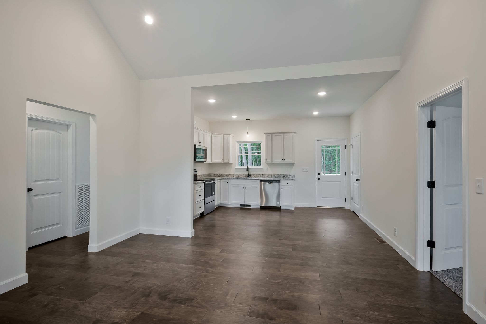 845 Lucas Road Dickson, TN 37055 - Photo 10 of 31 a view of an empty room with wooden floor and a cabinet