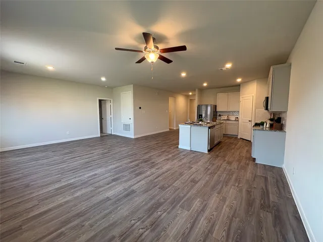 a view of a livingroom with wooden floor