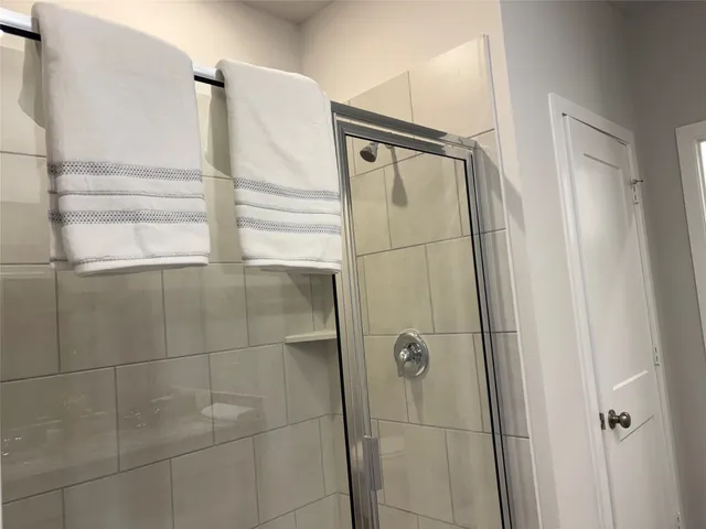 a white toilet sitting next to a white sink