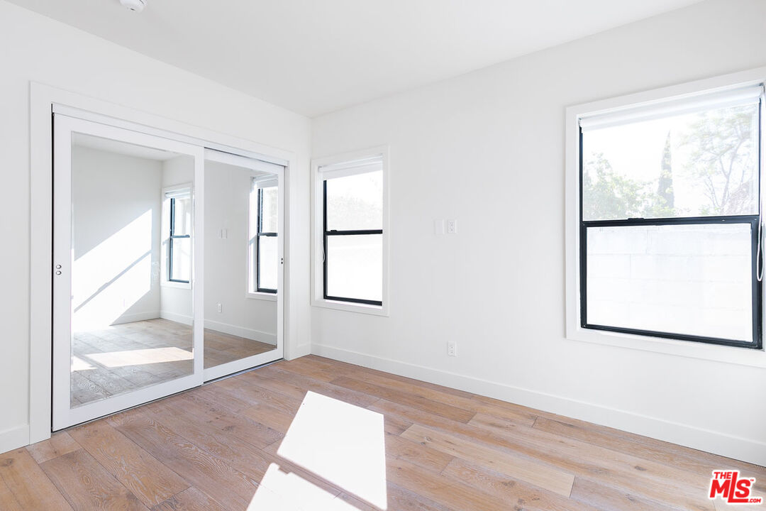 3375 Eagle Rock Boulevard Los Angeles, CA 90065 - Photo 11 of 12 an empty room with wooden floor and windows