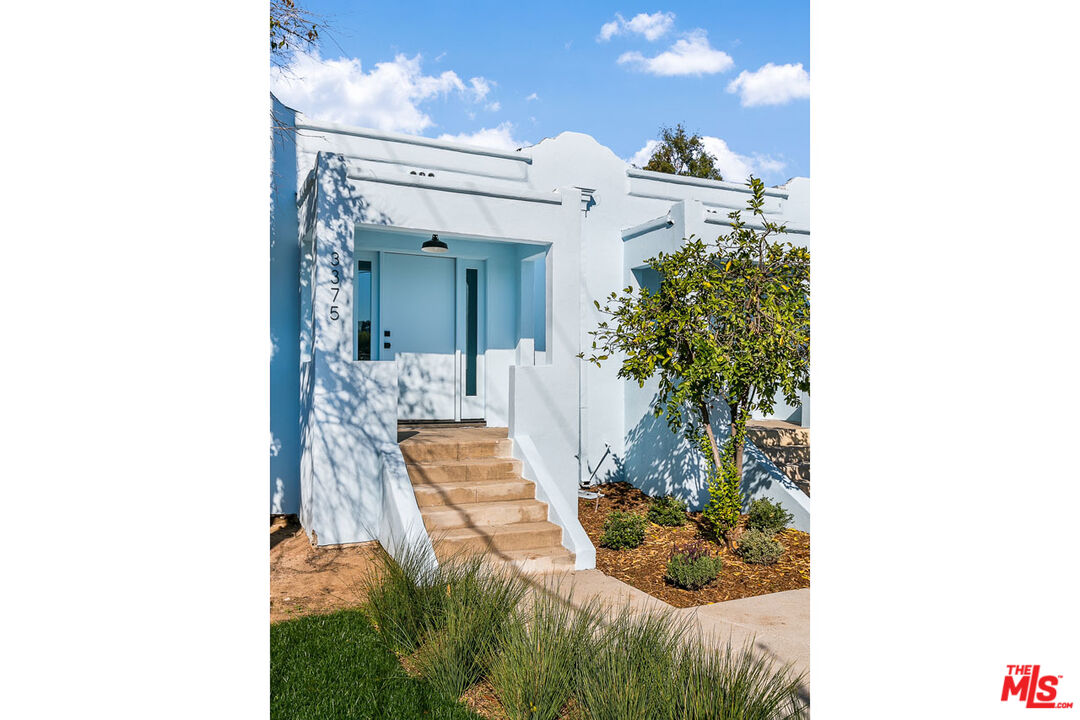 3375 Eagle Rock Boulevard Los Angeles, CA 90065 - Photo 2 of 12 a view of a living room with a lot of flower plants