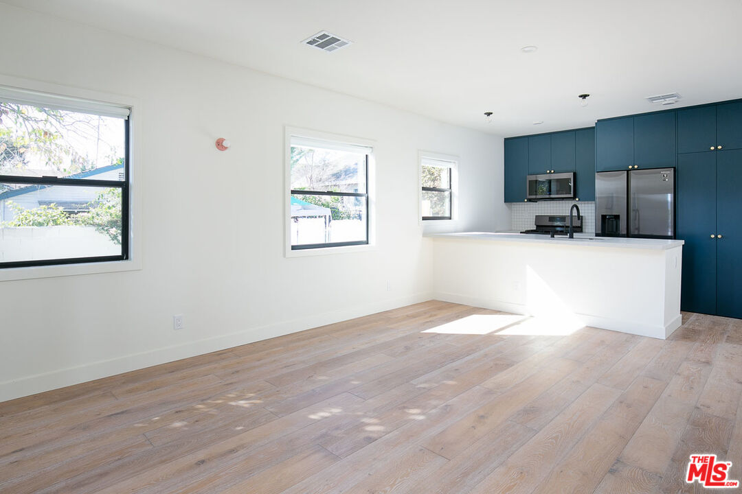 3375 Eagle Rock Boulevard Los Angeles, CA 90065 - Photo 4 of 12 a view of a kitchen with furniture and wooden floor
