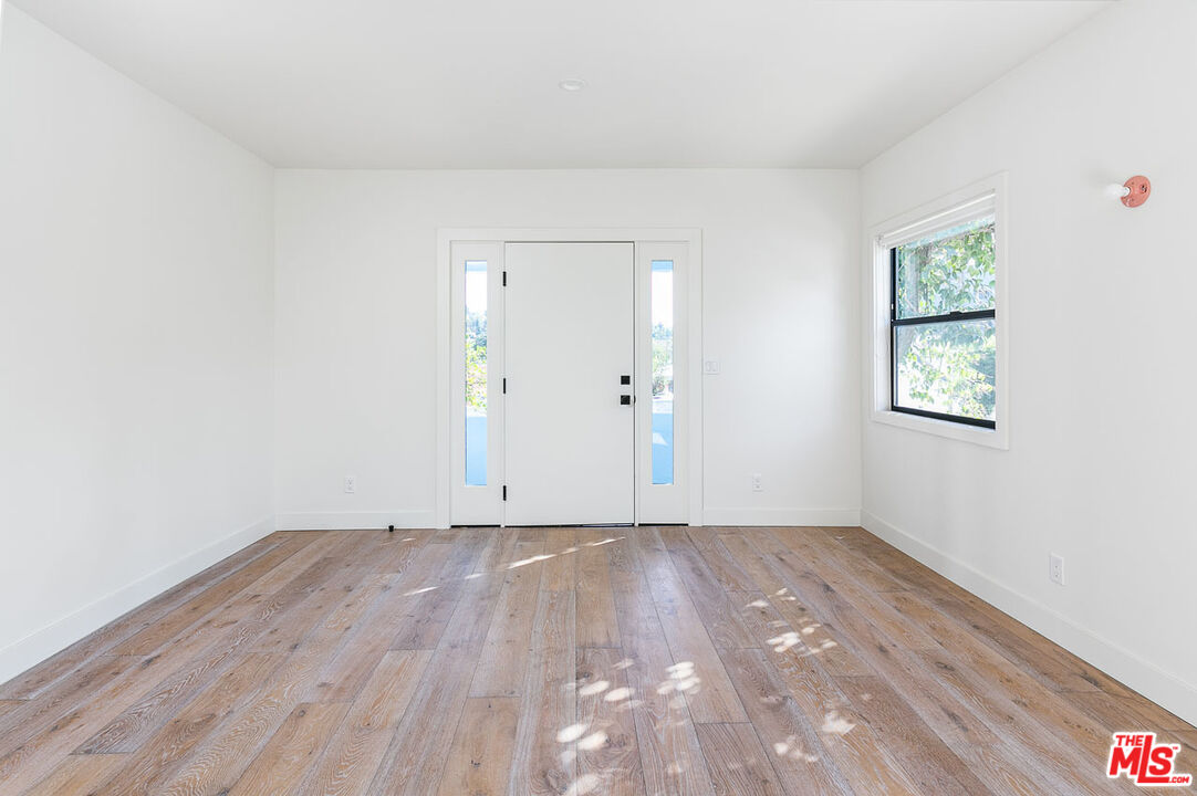 3375 Eagle Rock Boulevard Los Angeles, CA 90065 - Photo 5 of 12 an empty room with wooden floor and windows