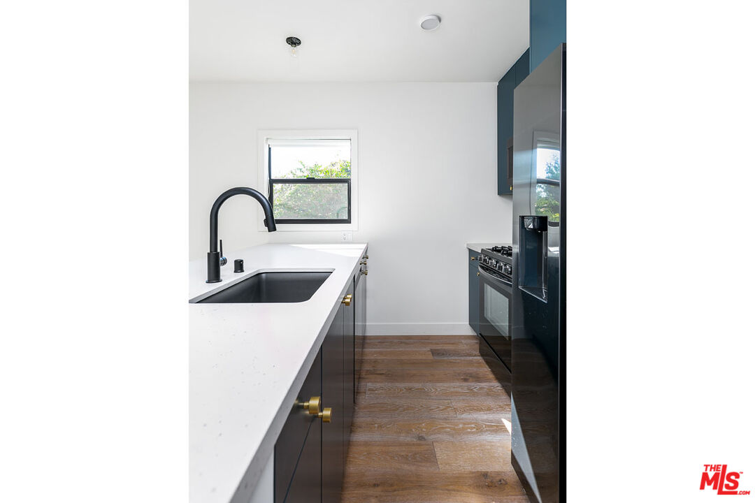 3375 Eagle Rock Boulevard Los Angeles, CA 90065 - Photo 6 of 12 a hallway with a sink and cabinets