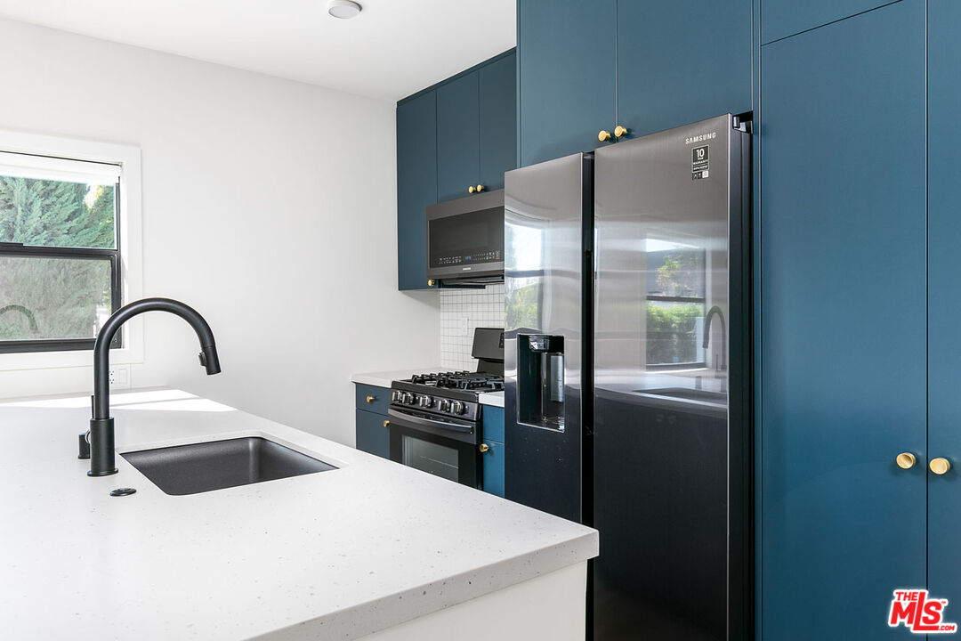 3375 Eagle Rock Boulevard Los Angeles, CA 90065 - Photo 7 of 12 a kitchen with a refrigerator and a sink