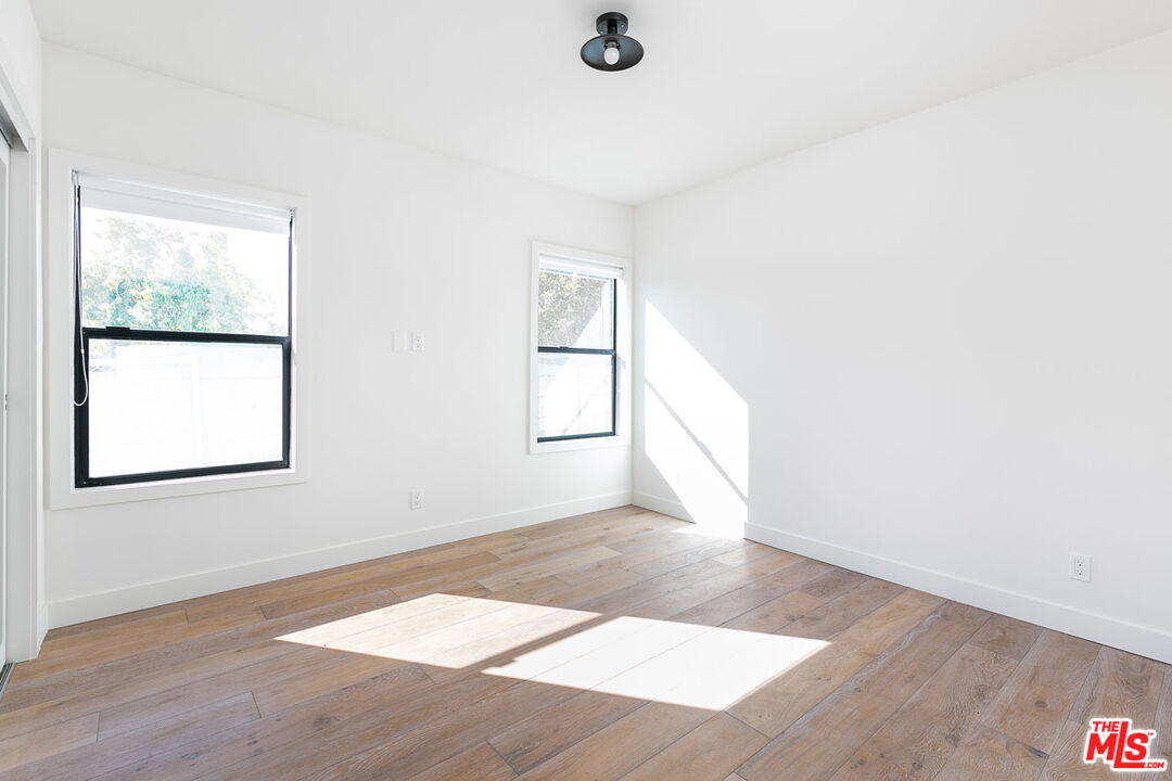 3375 Eagle Rock Boulevard Los Angeles, CA 90065 - Photo 10 of 12 an empty room with wooden floor and windows