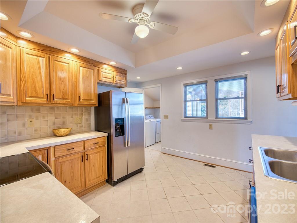 947 North Canton Road Canton, NC 28716 - Photo 15 of 24 a kitchen with refrigerator and cabinets