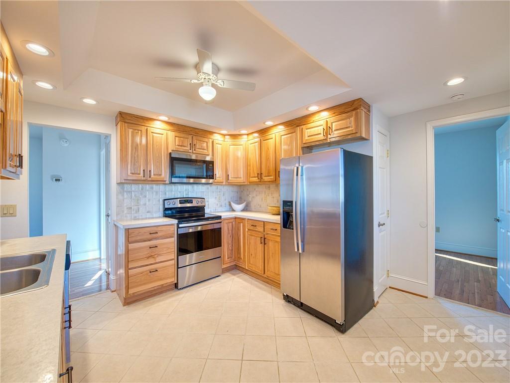 947 North Canton Road Canton, NC 28716 - Photo 16 of 24 a kitchen with granite countertop a refrigerator oven a sink dishwasher and a refrigerator