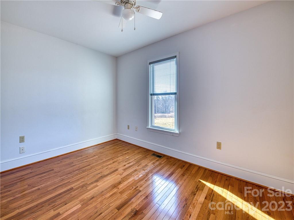 947 North Canton Road Canton, NC 28716 - Photo 20 of 24 wooden floor in an empty room with a window