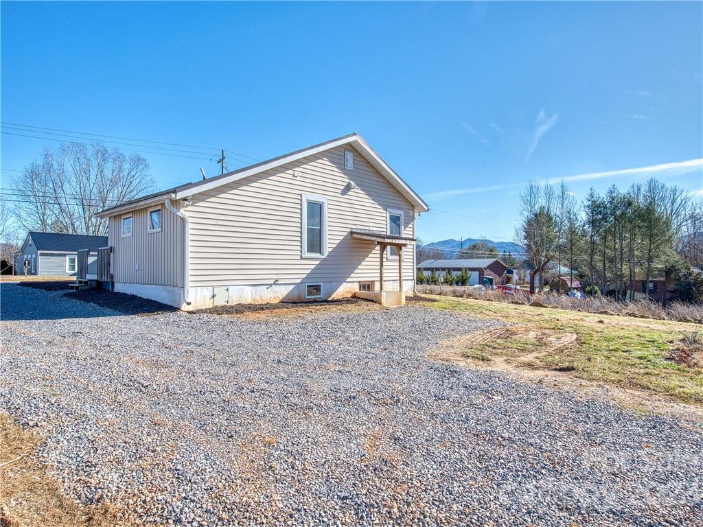 947 North Canton Road Canton, NC 28716 - Photo 5 of 24 a view of a house with backyard and trees