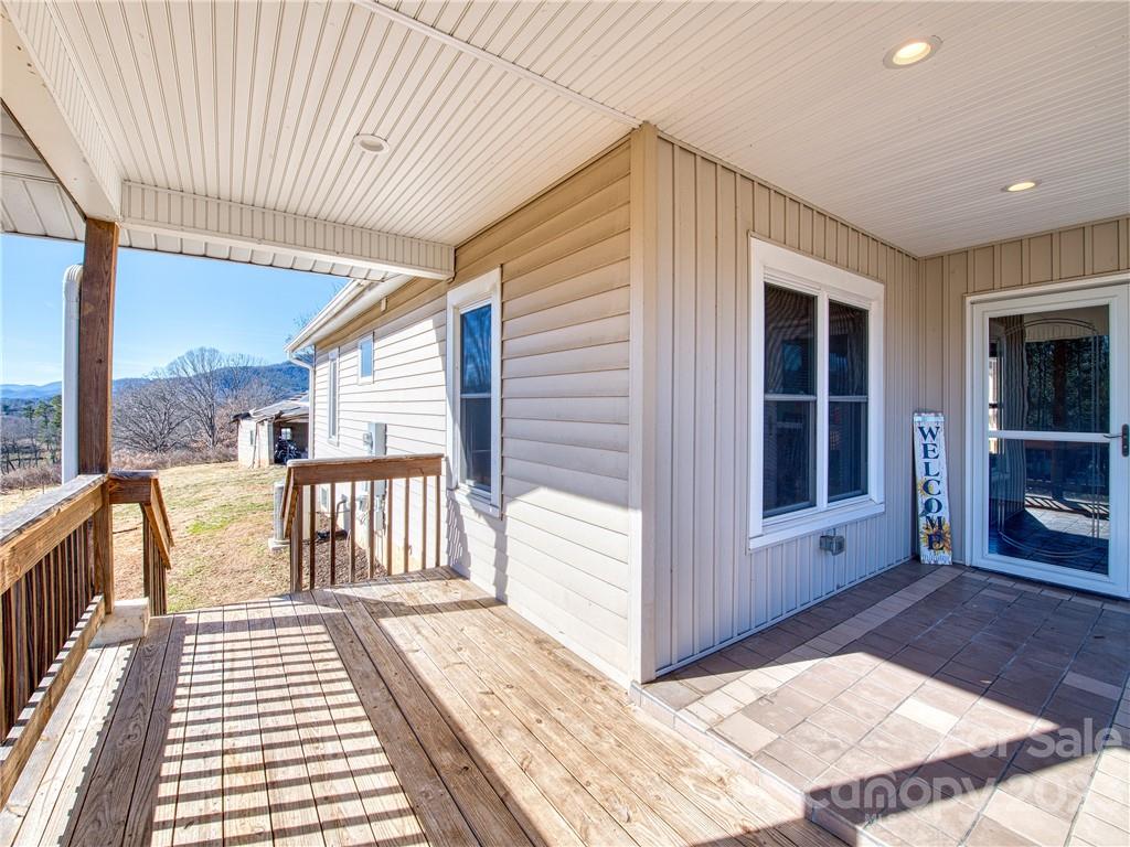 947 North Canton Road Canton, NC 28716 - Photo 8 of 24 a view of a balcony with wooden floor and iron stairs