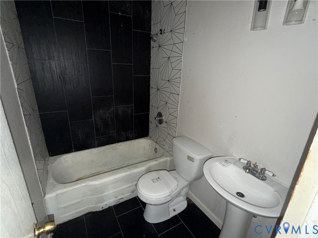 2401 Raleigh Street Hopewell, VA 23860 - Photo 8 of 10 a bathroom with a toilet and a shower