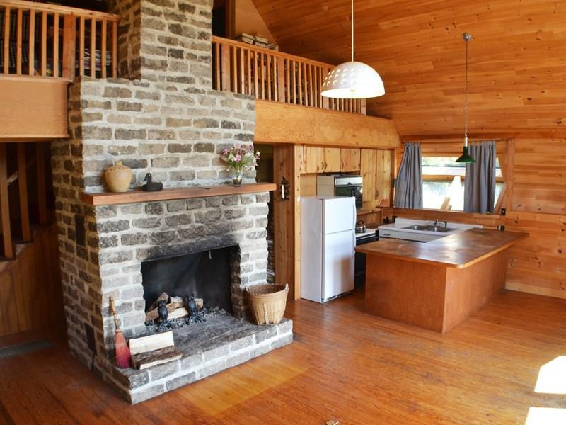 230 Minturn Road Swans Island, ME 04685 - Photo 7 of 18 Central granite fireplace in open...