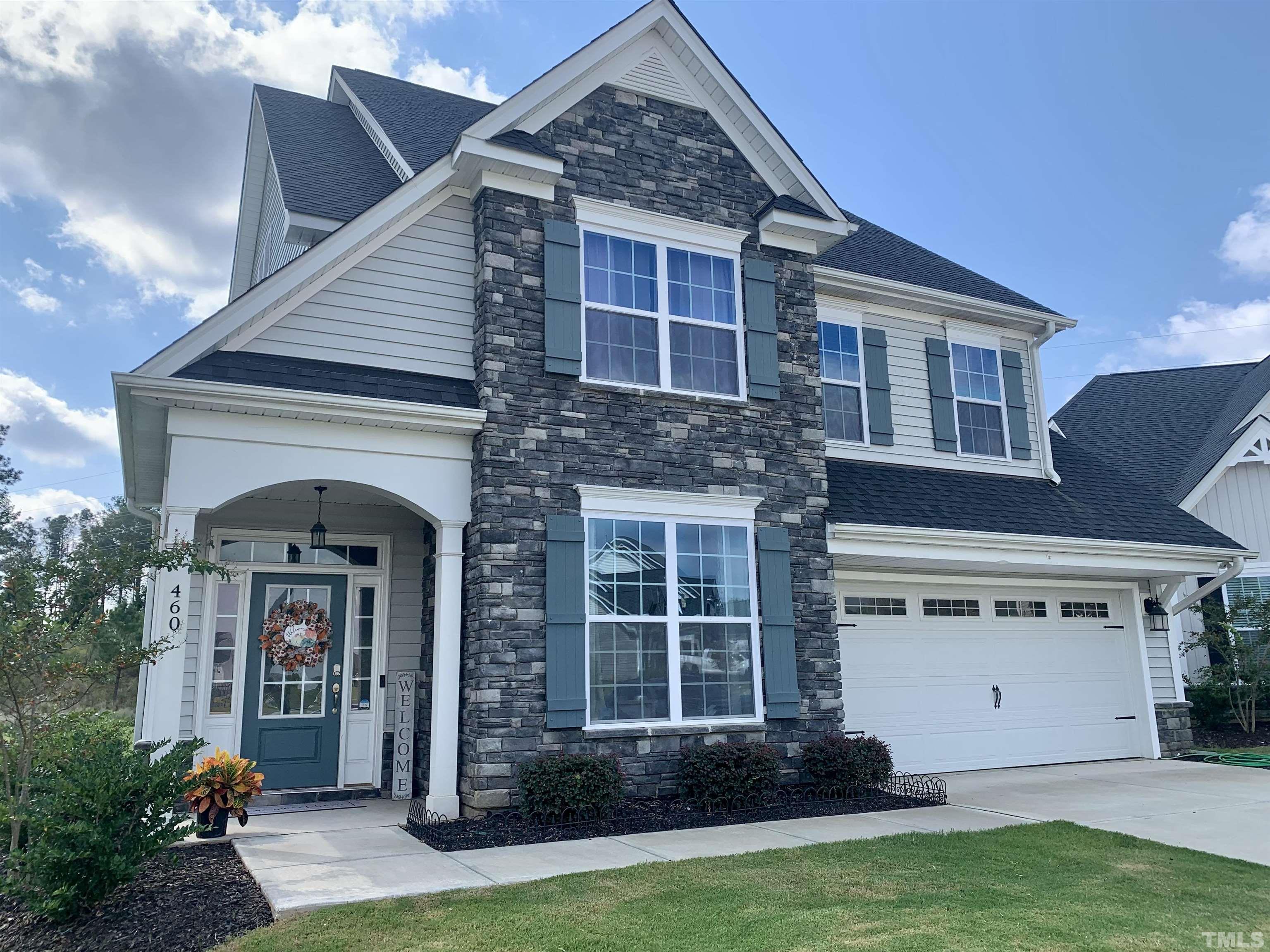 460 Mallard Loop Drive Clayton, NC 27527 - Photo 1 of 24 a front view of a house with garden