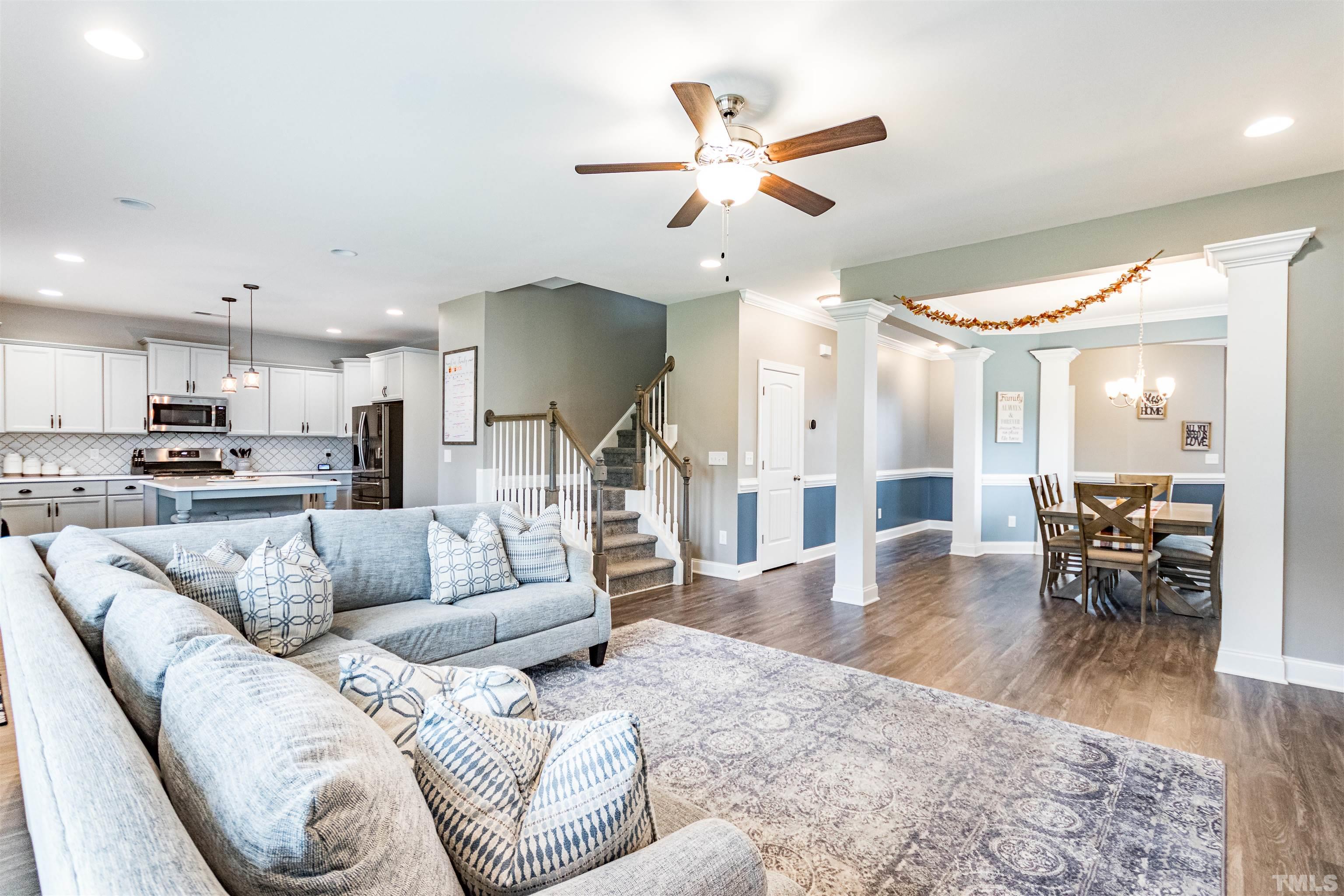460 Mallard Loop Drive Clayton, NC 27527 - Photo 11 of 24 a living room with furniture and kitchen view