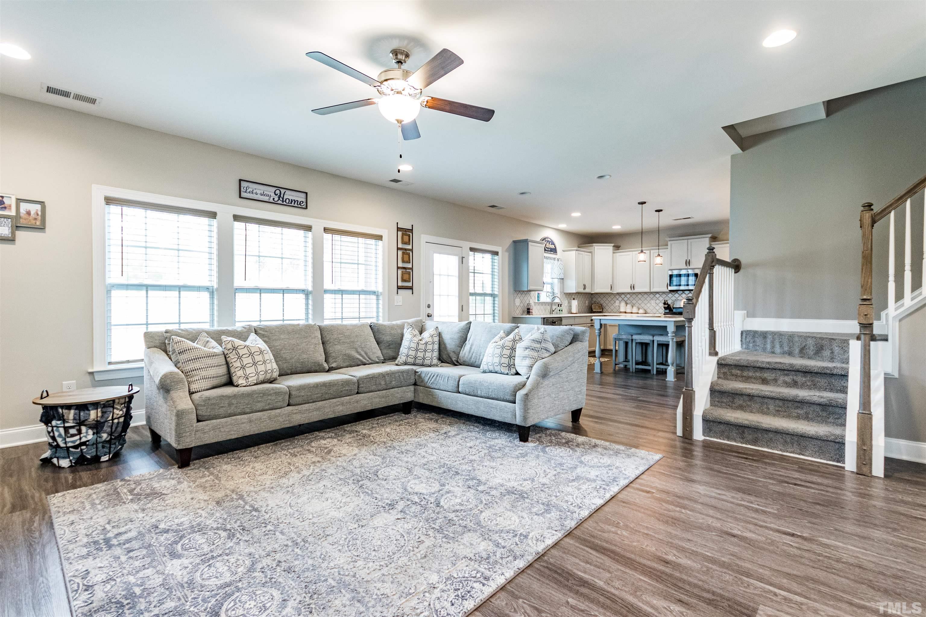 460 Mallard Loop Drive Clayton, NC 27527 - Photo 12 of 24 a living room with furniture and a large window