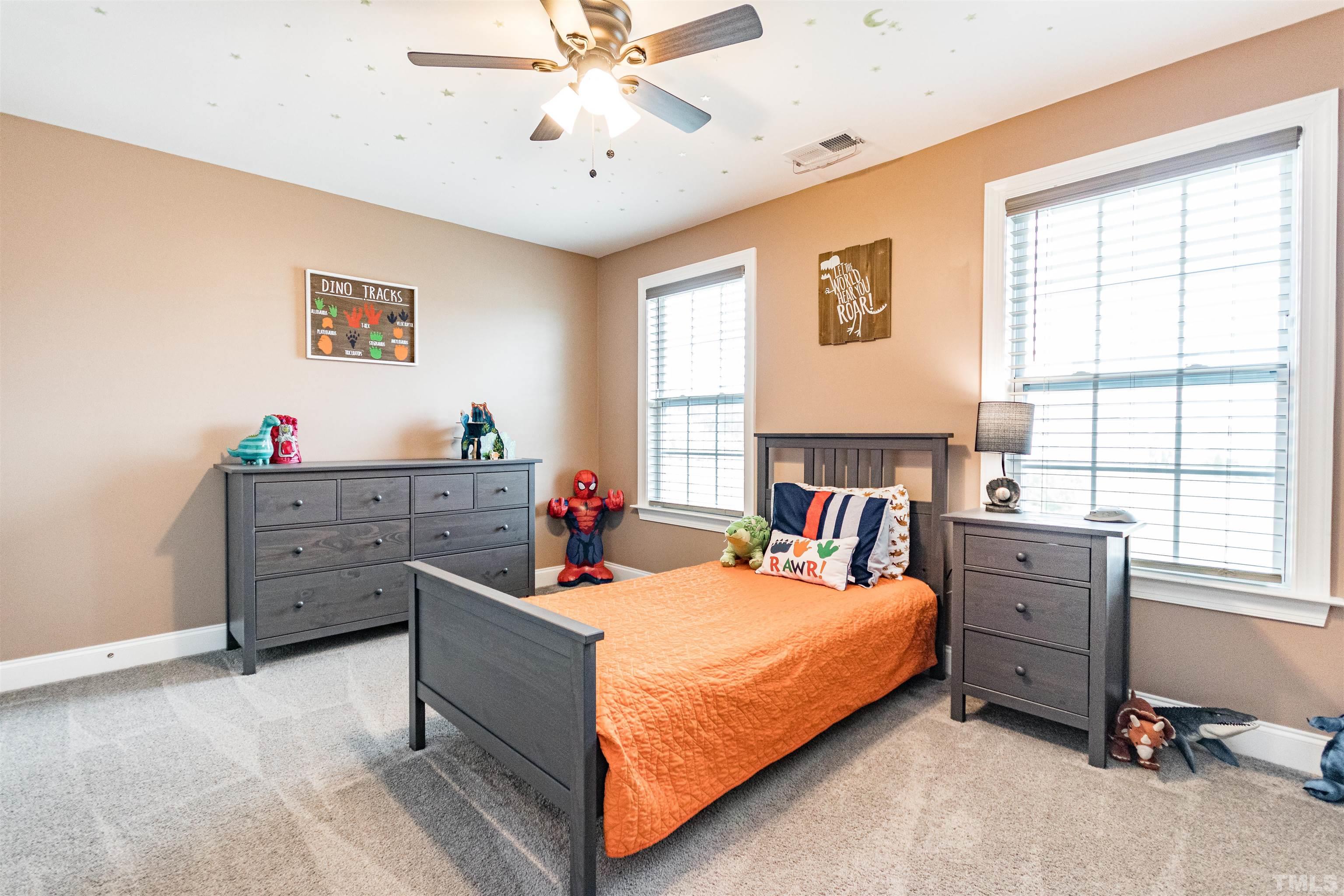 460 Mallard Loop Drive Clayton, NC 27527 - Photo 17 of 24 a bed room with a bed and a window