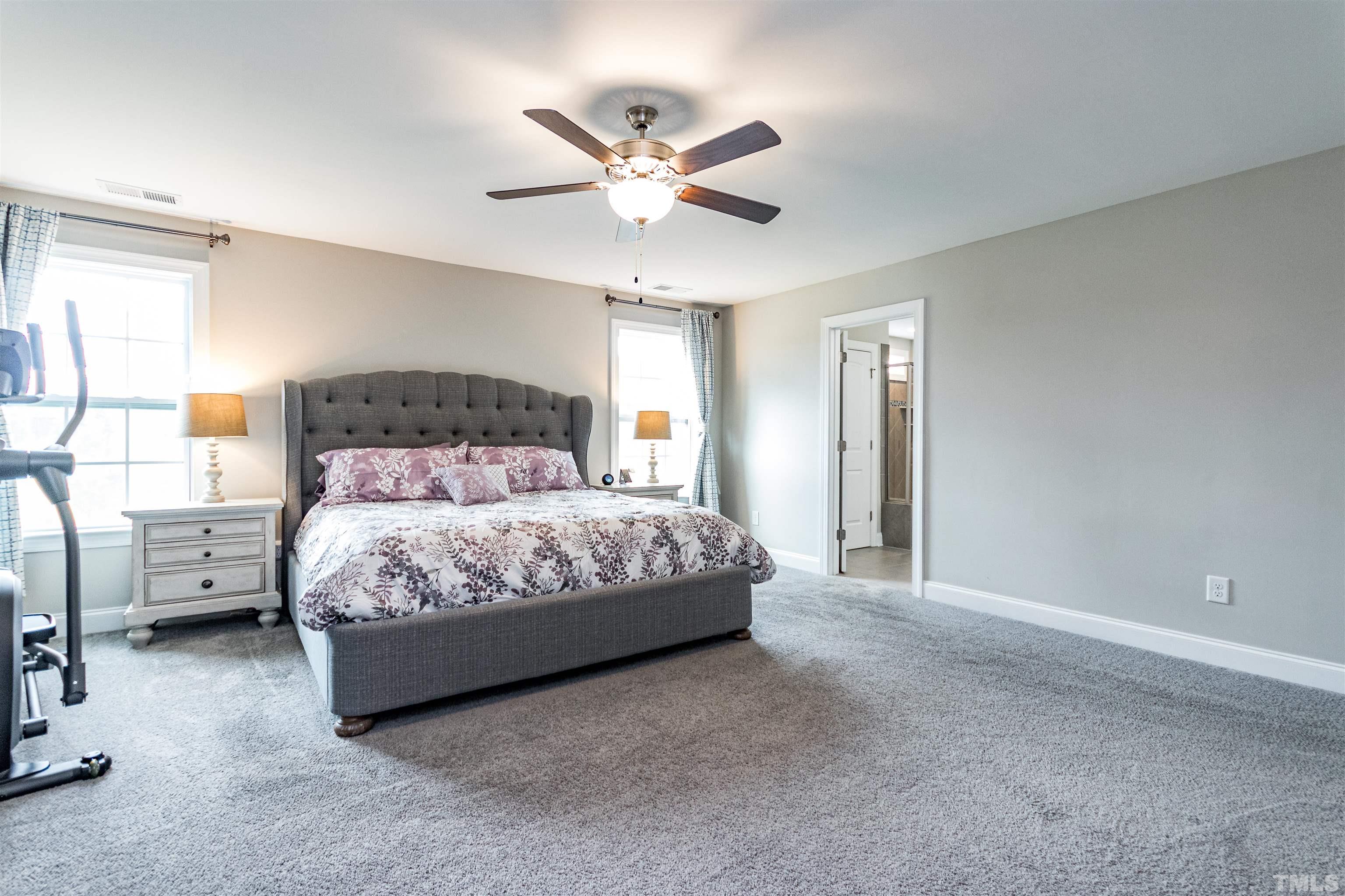 460 Mallard Loop Drive Clayton, NC 27527 - Photo 20 of 24 a bedroom with a bed and window