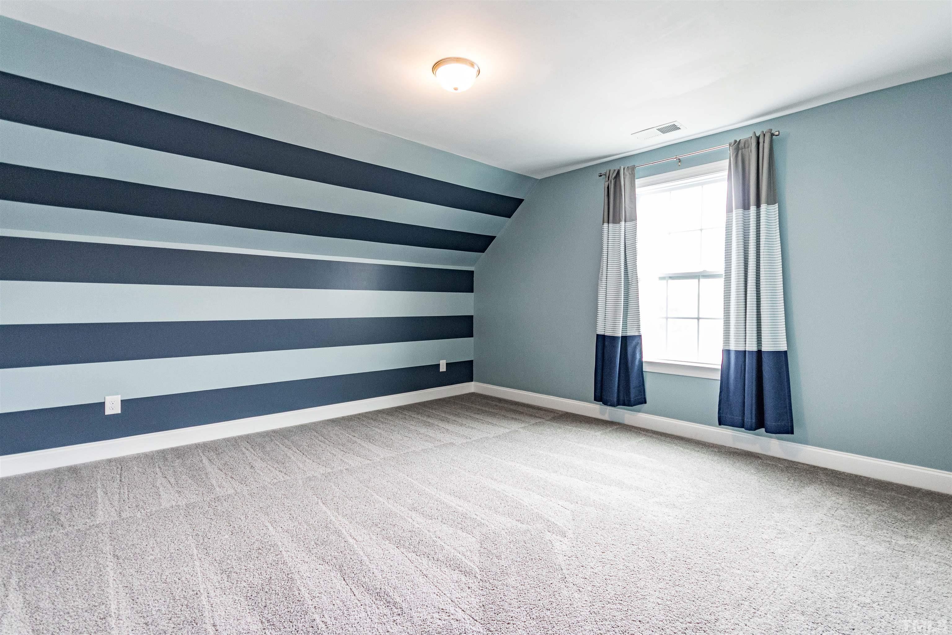 460 Mallard Loop Drive Clayton, NC 27527 - Photo 24 of 24 a view of an empty room with a window