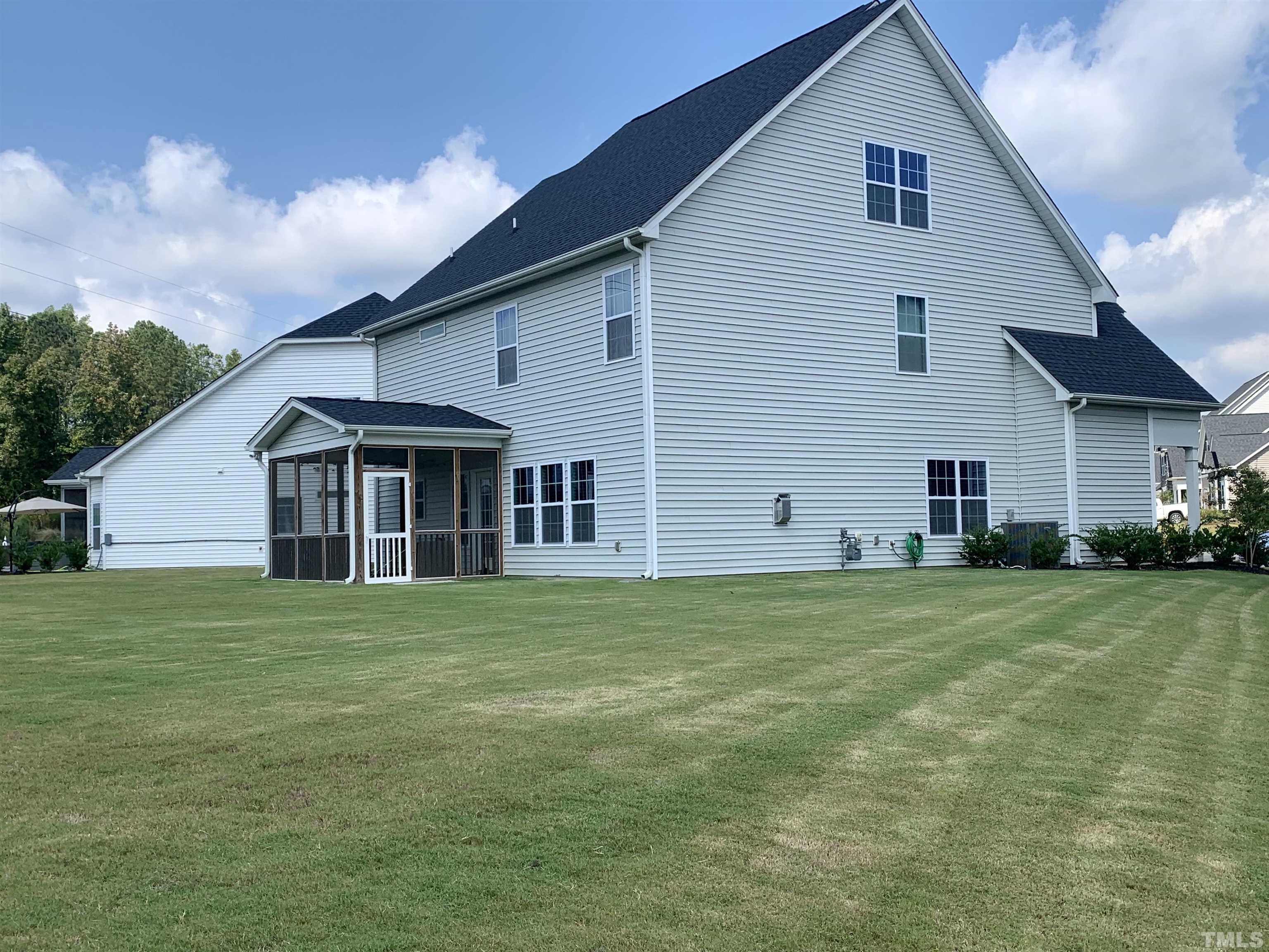 460 Mallard Loop Drive Clayton, NC 27527 - Photo 5 of 24 a front view of a house with a yard