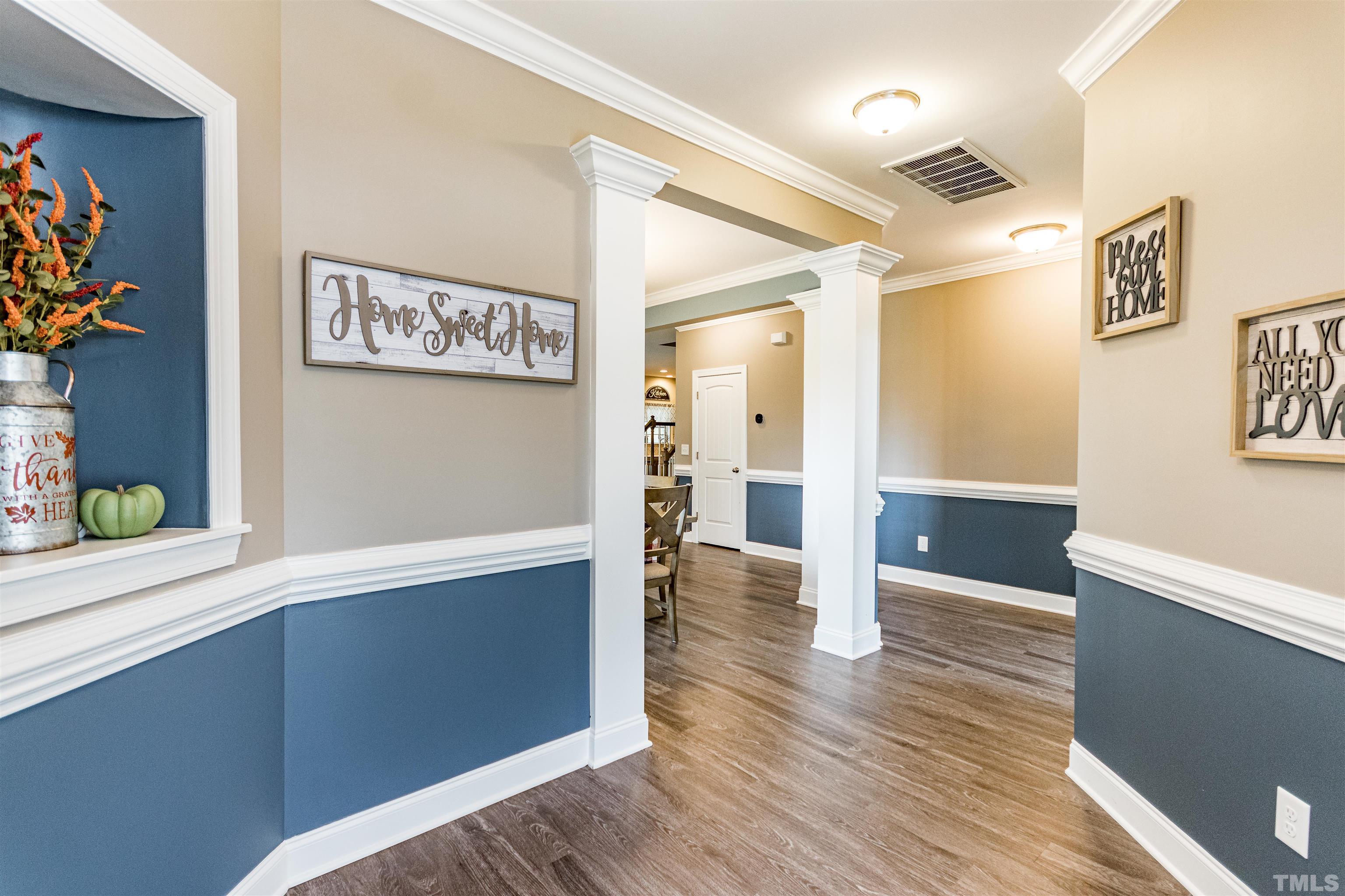 460 Mallard Loop Drive Clayton, NC 27527 - Photo 6 of 24 a view of a hallway with wooden floor