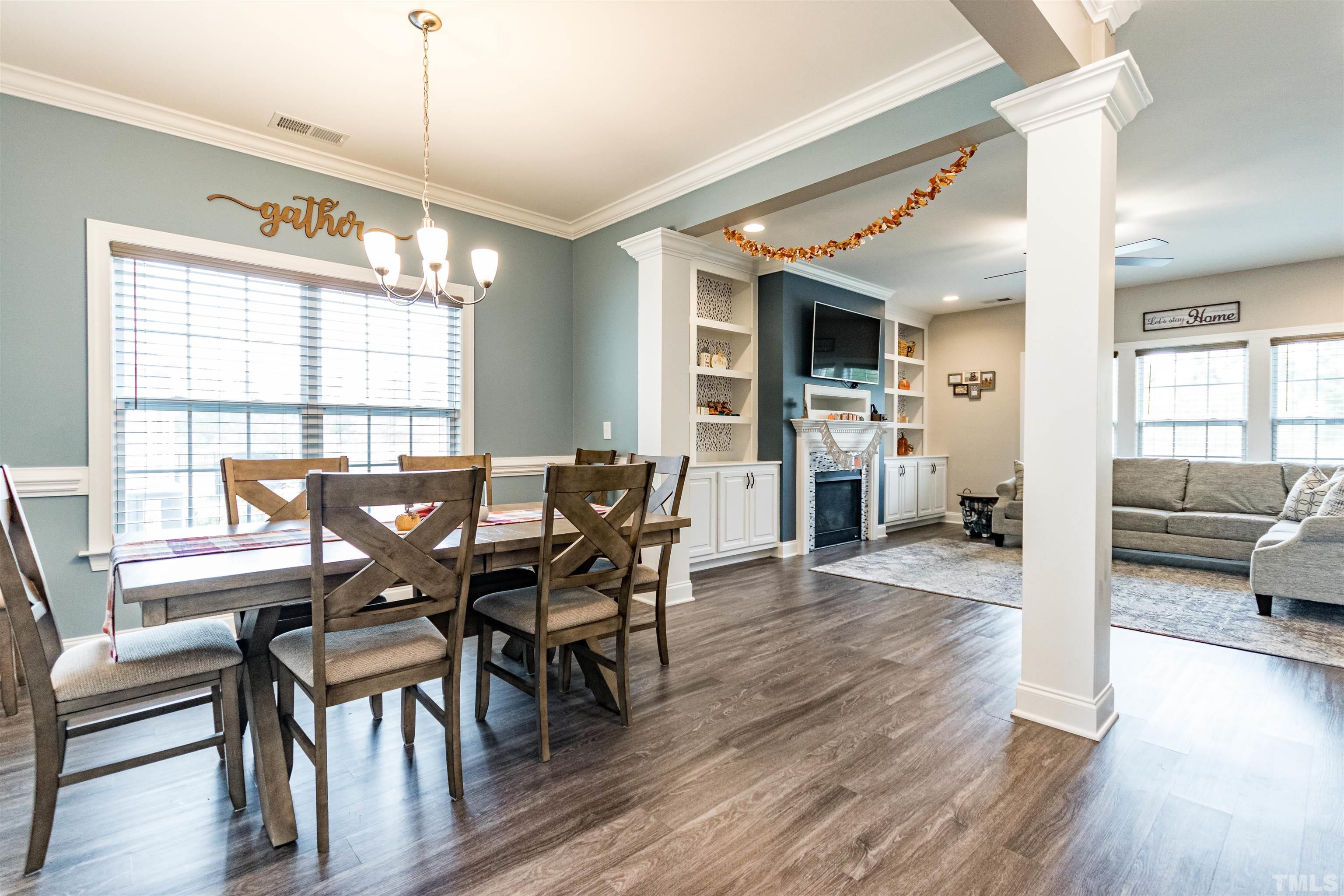 460 Mallard Loop Drive Clayton, NC 27527 - Photo 8 of 24 a view of a dining room with furniture window and wooden floor