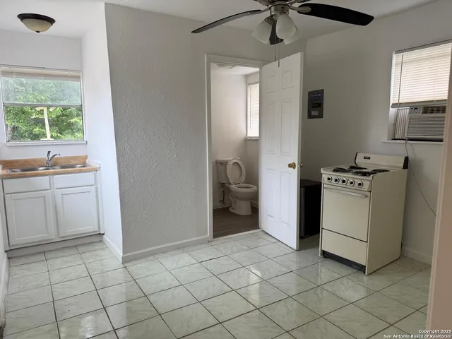 a room with a stove and a window