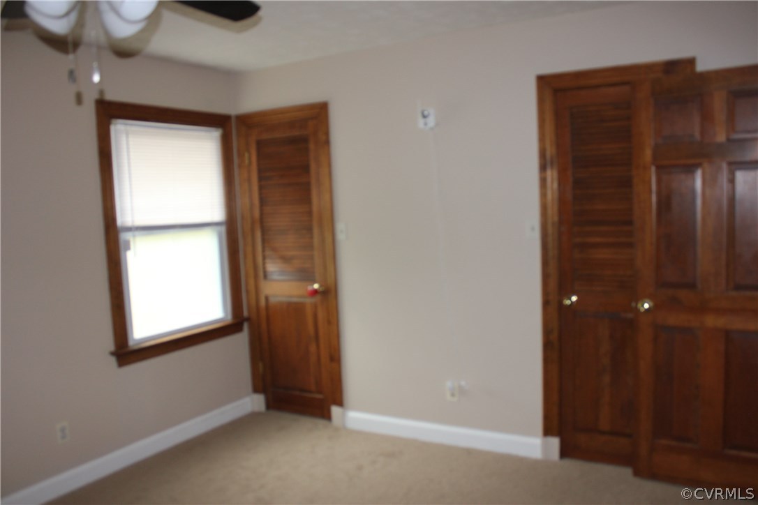 9321 Goodman Road Quinton, VA 23141 - Photo 32 of 44 THIRD BEDROOM ,CARPET AND CEILING FAN