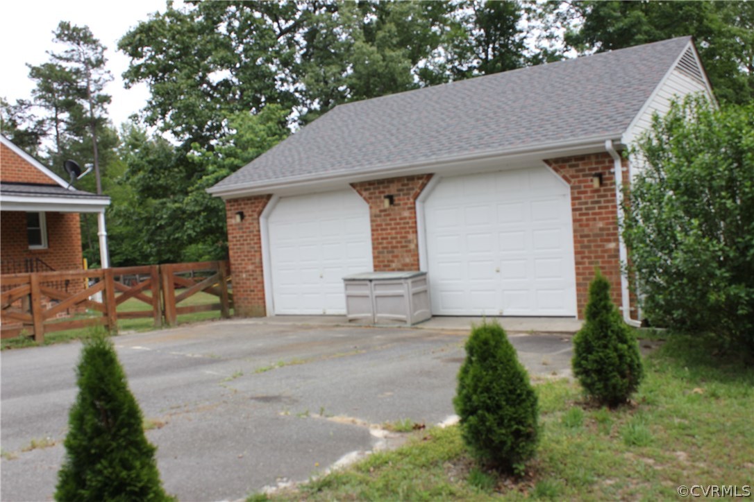 9321 Goodman Road Quinton, VA 23141 - Photo 36 of 44 OVERSIZED 2 CAR GARAGE