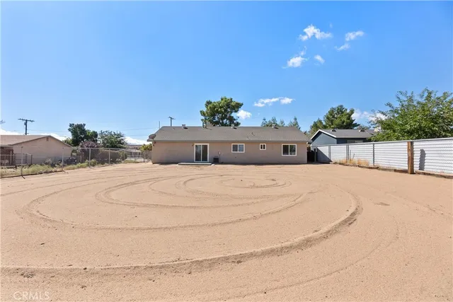 a bedroom with a bed and a potted plant
