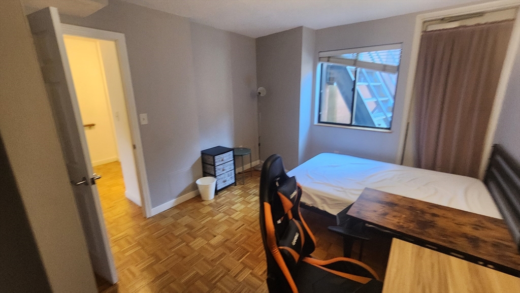 147 Kelton Street, Unit 706 Boston, MA 02134 - Photo 11 of 16 a bedroom with a bed and a window