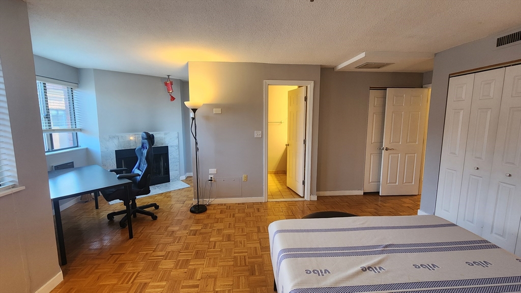 147 Kelton Street, Unit 706 Boston, MA 02134 - Photo 14 of 16 a living room with furniture and a window