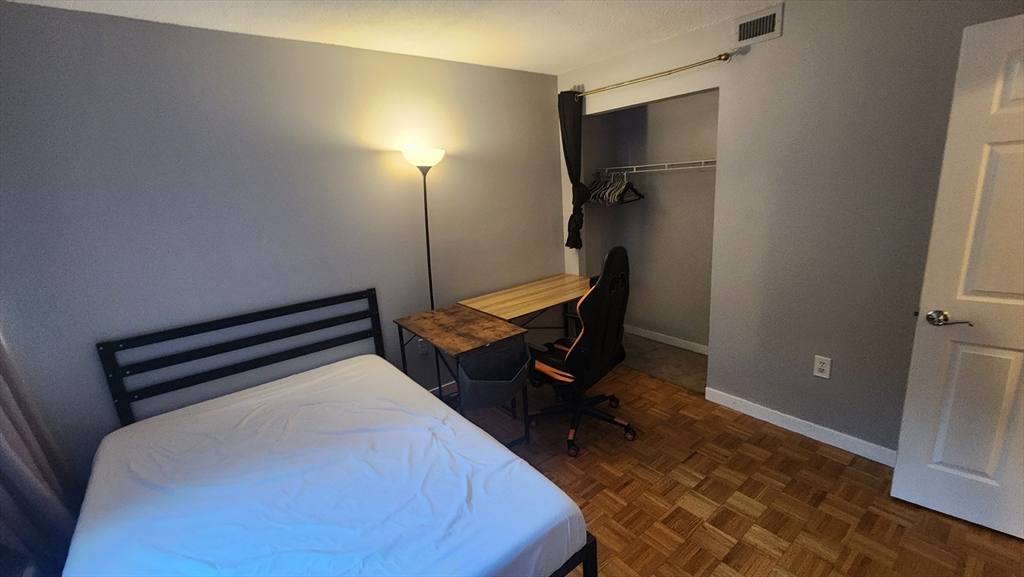 147 Kelton Street, Unit 706 Boston, MA 02134 - Photo 10 of 16 a room with furniture and a rug