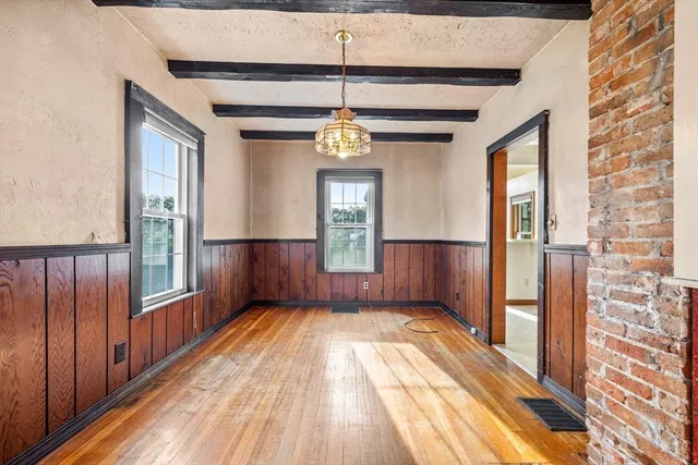 a view of a hallway with windows