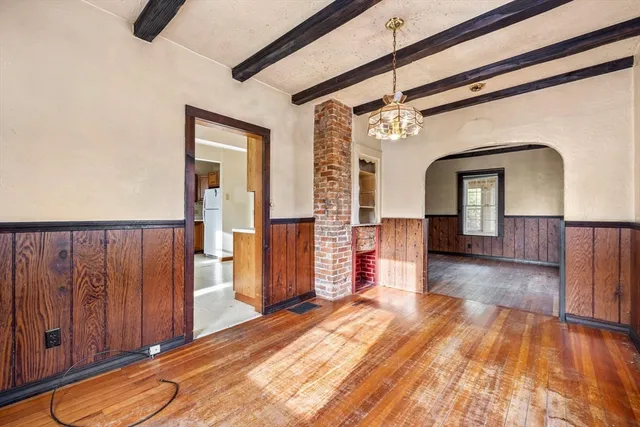 a view of a living room with a wooden floor