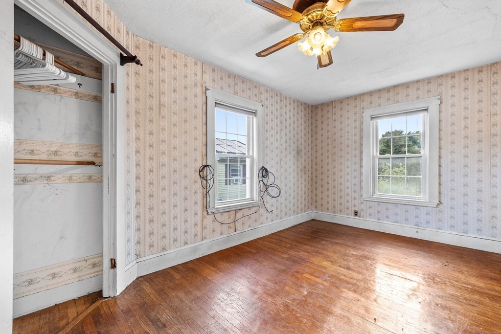 16 2nd Street Saugus, MA 01906 - Photo 23 of 37 an empty room with windows and fan