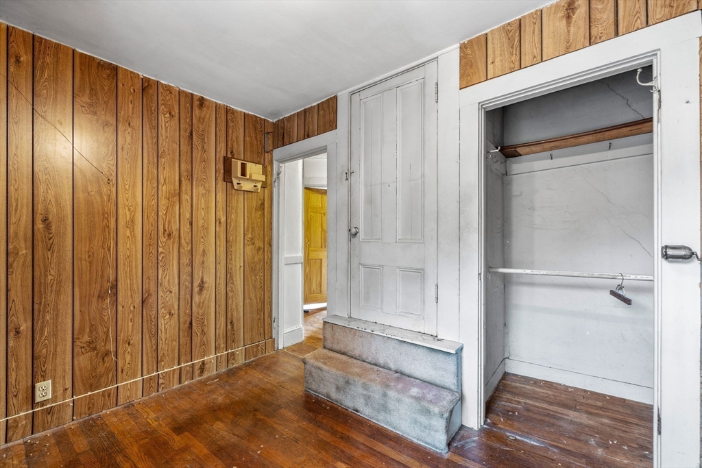 16 2nd Street Saugus, MA 01906 - Photo 27 of 37 a view of an empty room with wooden floor and a window