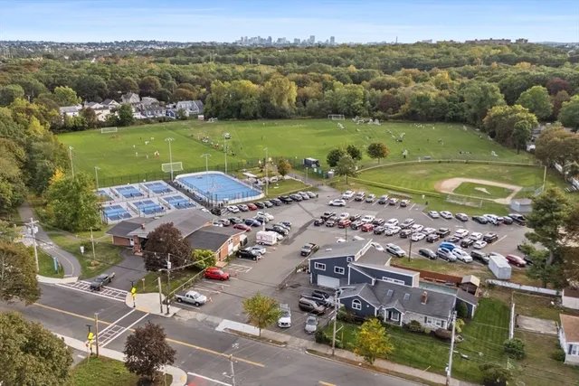 an aerial view of a houses with a lake view