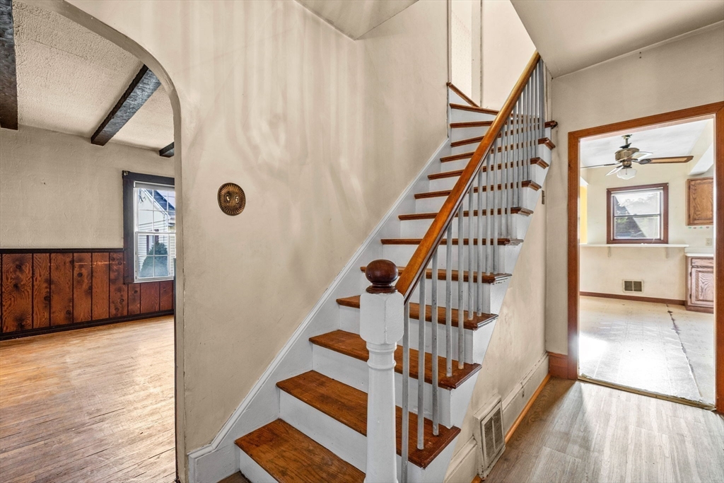 16 2nd Street Saugus, MA 01906 - Photo 5 of 37 a view of front door with wooden floor and stairs